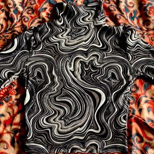 Medium length turtle neck black and white design. Not see through, super comfy